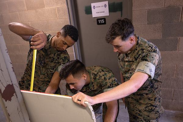 U.S. Marines with 1st Combat Engineer Battalion measure drywall during Operation Clean Sweep at Marine Corps Base Camp Pendleton, Calif., Oct. 29, 2024. Operation Clean Sweep is a joint initiative between Marine Corps Installations West and I Marine Expeditionary Force at Marine Corps Base Camp Pendleton to improve living conditions for Marines and Sailors. (U.S. Marine Corps photo by Lance Cpl. Jeslianne A. Torres).