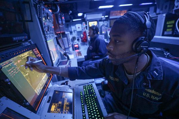 AT SEA (Nov. 15, 2024) – Lt. j.g. Marcus Wiggins, from Mobile, Alabama, stands watch in the combat information center aboard the Arleigh Burke-class guided-missile destroyer USS Dewey (DDG 105) while operating at sea in support of Freedom Edge 24-2, Nov. 15, 2024. Exercises such as Freedom Edge demonstrate a new era of trilateral cooperation to ensure peace and stability in the Korean Peninsula and the Indo-Pacific. (U.S. Navy photo by Mass Communication Specialist 1st Class Greg Johnson)