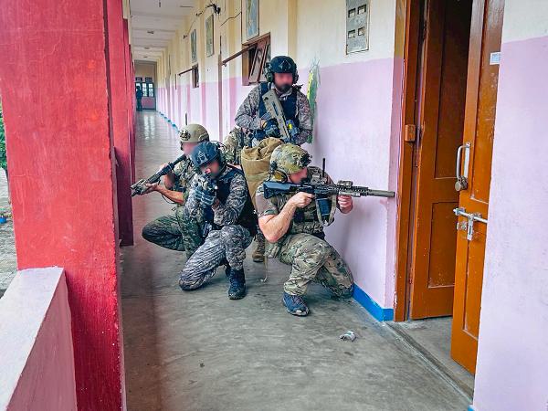 U.S. Naval Special Warfare operators and Indian Marine Commando Force members participate in close-quarters combat training in Visakhapatnam, India during exercise Malabar 2024, Oct. 12, 2024. Malabar 24 is a combined field training exercise with the Indian Navy, Japan Maritime Self-Defense Force and U.S. Navy participants. The exercise is designed to support achievement of strategic objectives by strengthening partnerships in the Indo-Pacific and promoting interoperability in the conduct of complex warfighting operations.  (Courtesy Photo) (Portions of this image have been blurred for security reasons.)