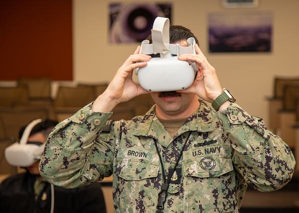 A Sailor assigned to Mid-Atlantic Regional Maintenance Center (MARMC) tests the Oculus headset utilized for sexual assault prevention and suicide prevention virtual reality training onboard Naval Station Norfolk, November 14, 2024. MARMC, a field activity under Naval Sea Systems Command (NAVSEA), provides surface ship maintenance, management and oversight of private sector maintenance and fleet technical assistance to ships in the Mid-Atlantic region of the United States. (U.S. Navy photo by Harrison Cox).              