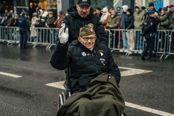 Soldiers from the 101st Airborne Division (Air Assault) Soldiers march in a parade in Bastogne, Belgium alongside World War II veterans making stops at the Gen. Patton and Gen. McAullife monuments on December 14, 2024. The 80th anniversary of Bastogne and the Battle of the Bulge commemorates the Soldiers of the 101st Airborne Division (Air Assault) as they defended the city and region from the German offensive during World War II.
