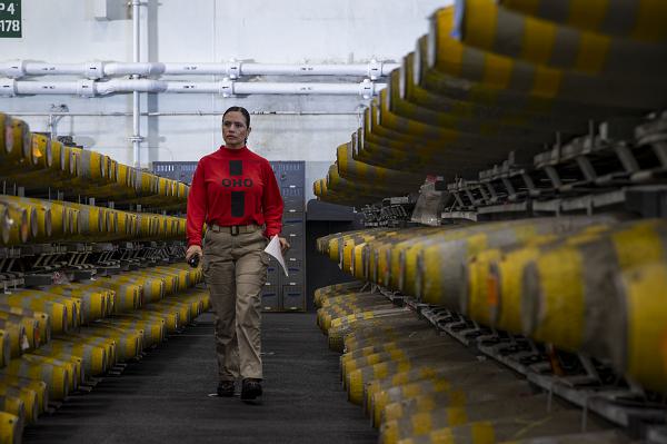 Lt. Cmdr. Maria Relayo, from Huntington Park, Calif., inspects ammunition before transportation aboard the Nimitz-class aircraft carrier USS Abraham Lincoln (CVN 72) during an ammunition transfer with the Lewis and Clark-class dry cargo ship USNS Washington Chambers (T-AKE 11). Abraham Lincoln, flagship of Carrier Strike Group Three, is underway conducting routine operations in the U.S. 3rd Fleet area of operations. As an integral part of U.S. Pacific Fleet, U.S. 3rd Fleet operates naval forces in the Indo-Pacific in addition to providing realistic and relevant training necessary to flawlessly execute our Navy’s timeless roles of sea control and power projection. U.S. 3rd fleet works in close coordination with other numbered fleets to provide commanders with capable, ready forces to deploy forward and win in day-to-day competition, in crisis, and in conflict. (U.S. Navy photo by Mass Communication Specialist Seaman Malina Davy)                                                  