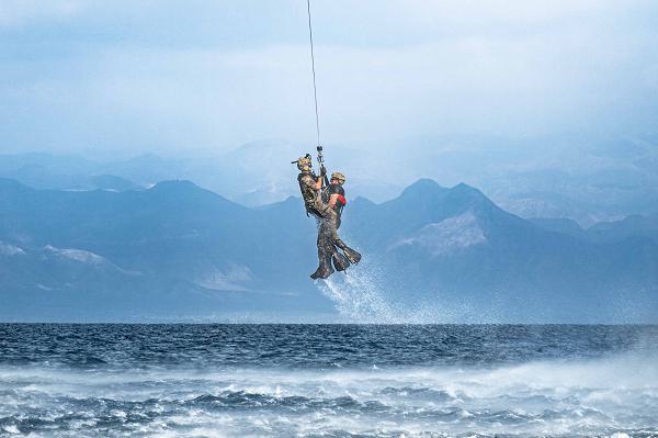 A U.S. Air Force pararescueman assigned to the 82nd Expeditionary Rescue Squadron (ERQS) recovers personnel in the water during exercise Bull Shark in Djibouti on November 26, 2024. The exercise simulated multiple personnel recovery scenarios in water allowing for the coordination of land, sea, and air components from multiple U.S. military branches, the Spanish Navy, and the Djiboutian Coast Guard. (U.S. Air Force photo by Staff Sgt. Jana Somero)