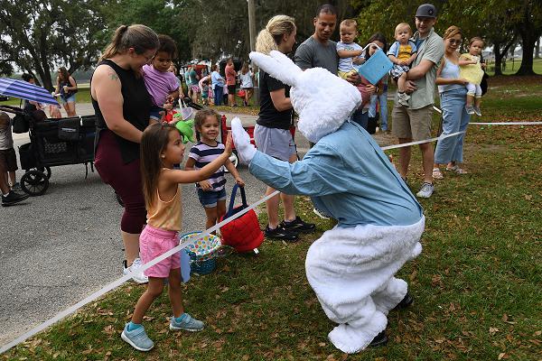 The Easter Bunny visits with Keesler families during Easter in the Park at Keesler Air Force Base, Mississippi, April 1, 2023. The 81st Force Support Squadron hosted the event for military children. (U.S. Air Force photo by Kemberly Groue)
