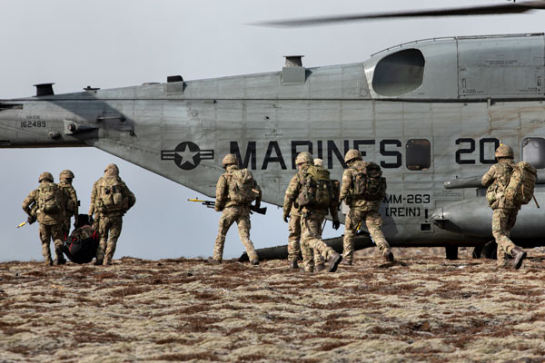 ICELAND, April 8, 2022 – Royal Marine Commandos assigned to M Company, 42 Commando Royal Marines board a U.S. Marine Corps CH-53E Super Stallion assigned the Aviation Combat Element, 22nd Marine Expeditionary Unit while participating in a tactical recovery of aircraft and personnel exercise during Northern Viking 2022 on Keflavik Airbase, Iceland, April 8, 2022. Northern Viking 22 strengthens interoperability and force readiness between the U.S., Iceland and Allied nations, enabling multi-domain command and control of joint and coalition forces in the defense of Iceland and Sea Lines of Communication in the Greenland, Iceland, United Kingdom (GIUK) gap.  Photo by Cpl. Yvonna Guyette)
