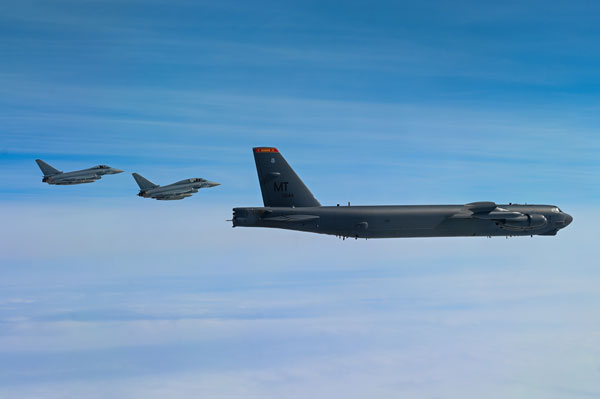Mediterranean, April 5, 2022 –  Two German Air Force Eurofighters escort a United States Air Force B-52H Stratofortress assigned to the 69th Expeditionary Bomb Squadron at RAF Fairford, England April 5, 2022. The German Air Force escorted the 69th EBS on their way to the Mediterranean region to integrate with Allies as part of pre-planned Bomber Task Force Europe series of missions.  Photo by Airman 1st Class Zachary Wright.