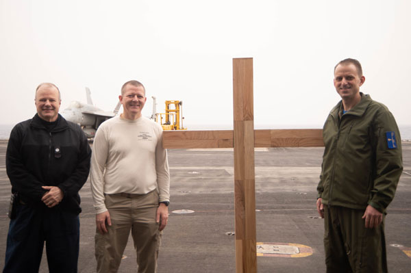 IONIAN SEA, April 17, 2022 -  220417-N-JU123-2185 IONIAN SEA (April 17, 2022) Cmdr. Chris Hester, from LaGrange, Georgia, left, Lt. Cmdr. Steven Hervey, center, from Silver Lake, Kansas, and Lt. Mike Smith, from Roanoke, Virginia, pose for a photo with a cross after an Easter Sunday service on the flight deck of the Nimitz-class aircraft carrier USS Harry S. Truman (CVN 75), April 17, 2022. The Harry S. Truman Carrier Strike Group is on a scheduled deployment in the U.S. Sixth Fleet area of operations in support of U.S., allied and partner interests in Europe and Africa.  Photo by Specialist Seaman Jibreel Uddin. 