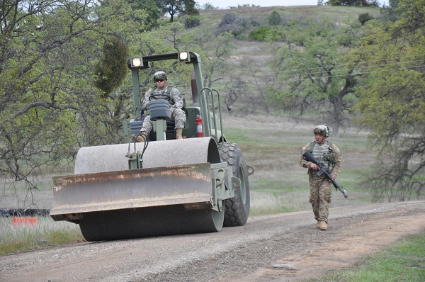 In this U.S. Army photo, Specialist Richard Rodriquez of the 475th Engineering Company from Ponce, Puerto Rico, conducts construction operations while guarded by Sergeant Norbert Prats during a combat support exercise at Fort Hunter Liggett, California. The 475th has a proud history of fighting America’s battles from Normandy, France on D-Day to battles in northern France and the Ardennes-Alsace region.  In 2007, the unit moved to Puerto Rico where these engineers stand ready to serve when their country needs them.