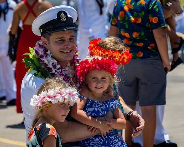 In the photo by Navy Electronics Technician (Nuclear) 2nd Class Leland T. Hasty II, Senior Chief Sonar Technician (Submarine) Donald Mattes reunites with his family after seven months at sea, returning to Joint Base Pearl Harbor-Hickam from deployment with the 7th Fleet.  Senior Chief Mattes hails from Crown Point, Indiana and is assigned to the Virginia-class fast attack submarine the U.S.S. North Carolina.