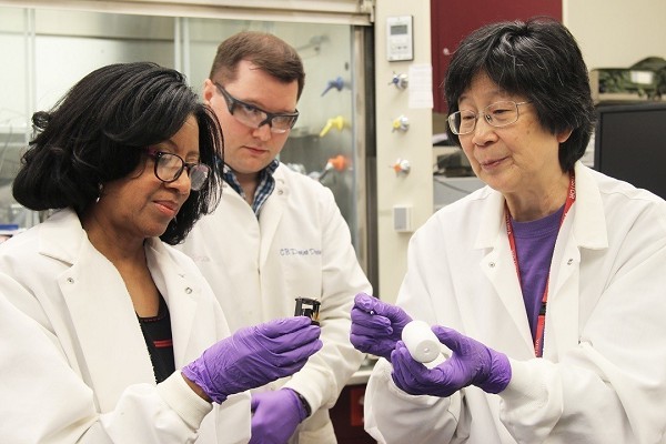 In this U.S. Army photo by Janet Wychock, Army Research Scientist for Chemistry Dr. Patricia McDaniel, left, works with research scientists Brian Hauck and Janet Jensen to explore chemical and biological detection technologies to protect warfighters in the field. 