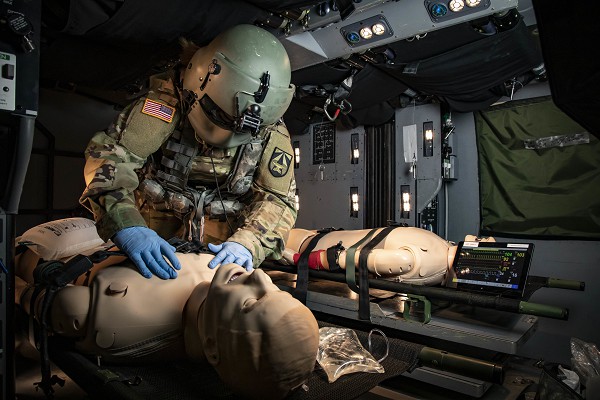 In this U.S. Army photo by Scott C. Childress, a Aeromedical Research Laboratory paramedic tests new items in a space utilization study at the Army’s School of Aviation Medicine’s DUSTOFF Training Complex, Ft. Rucker, Alabama. Here America’s military personnel train to become flight surgeons, critical care flight paramedics, and aviation nurse practitioners.