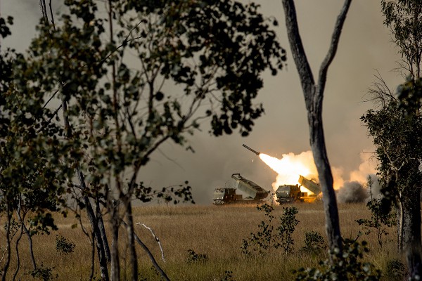 Queensland, Australia. (August 2, 2022): In this photo by Lance Corporal Alyssa Chuluda, a U.S. Army High Mobility Artillery Rocket System (HIMARS) with Alpha Battery, 1st Battalion, 94th Field Artillery Regiment, 12th Field Artillery Brigade and a United States Marine Corps HIMARS with 3rd Battalion, 3rd Marines, fire rockets during Exercise Talisman Sabre on Shoalwater Bay Training Area in Queensland, Australia. These Army and Marine sister units jointly train on the deadly HIMARS system that is turning the tide in Ukraine.