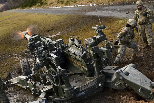 In this U.S. Army photo by Kevin Payne, 1st Lieutenant Nancy Gomez fires an M777 Howitzer during direct fire exercises at Grafenwoehr Training Area, Germany. The “Triple Seven” uses Excalibur rounds; a 155mm extended range shell that uses a jam-resistant internal GPS receiver to guide it to its target and is accurate to within 30 feet.  