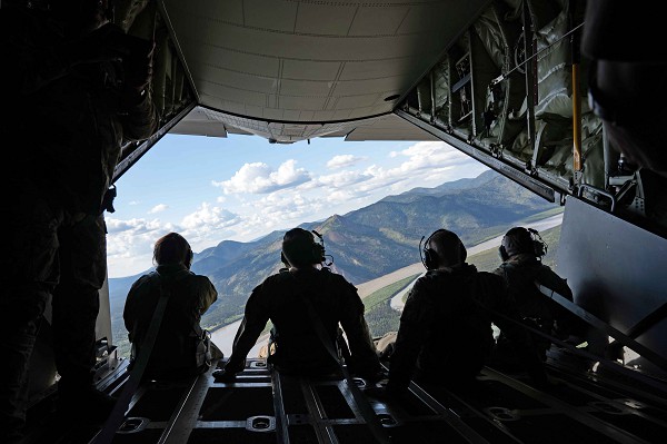 Kadena Air Base, Japan. (August 22, 2022): In this photo by Airman 1st Class Julia Lebens, U.S. Air Force Airmen enjoy the view as they sit on the ramp of a MC-130J Commando II aircraft assigned to the 1st Special Operations Squadron during Red Flag exercises held here recently. Red Flag is designed to give realistic training while testing interoperability between U.S. and Japanese forces in a simulated combat environment.