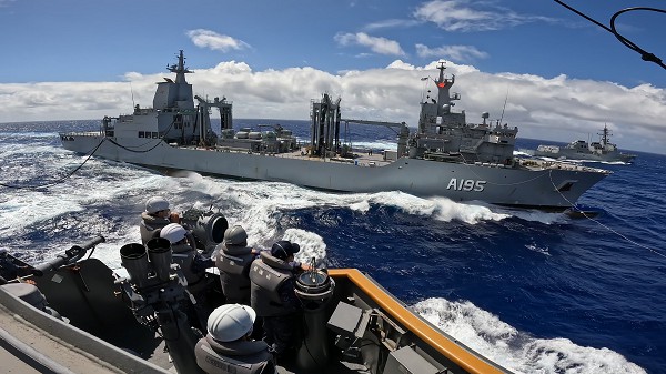 Pacific Ocean (July 26, 2022): In this photo by Petty Officer 1st Class Miura Naoto, the Japan Maritime Self-Defense Force Destroyer JS Takanami conducts replenishment-at-sea with the Royal Australian Navy oiler ship HMAS Supply during Rim of the Pacific Exercises (RIMPAC), 2022. 