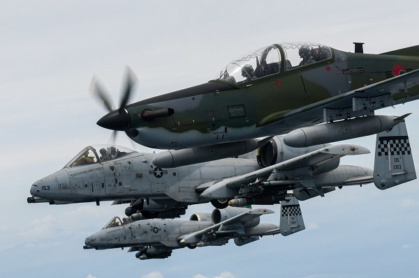 Wonju Air Base, South Korea. (August 21, 2022): In this photo by South Korean Air Force Master Sergeant Hyung Kwon, a Republic of Korea KA-1 Woongbi, a locally built flight trainer, flies alongside two U.S. A-10 Thunderbolts assigned to the American 25th Fighter Squadron participating in Buddy Squadron 22 exercises held here recently.  The Republic of Korea Air Force trains with American pilots regularly to develop trust, introduce new tactics, and improve readiness.