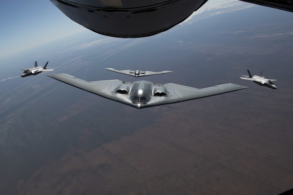 Melbourne, Australia. (August 26, 2022):  In this photo by Technical Sergeant Dylan Nuckolls, two U.S. Air Force B-2 Spirit bombers assigned to the 509th Bomb Wing at Whiteman Air Force Base, Missouri, fly a bomber task force mission alongside two Royal Australian Air Force F-35 Lightning II bombers during Koolendong 22, a precursor to the restart of Pitch Black, a 16-nation air combat exercise over Australia Northern Territories that is expected to run through September, 2022.