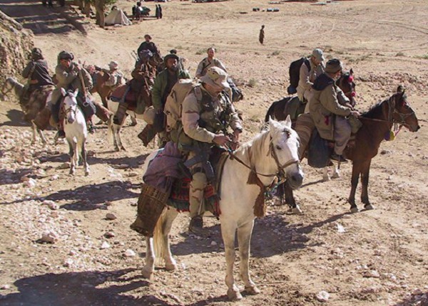 Sho-I-Khot Valley, Afghanistan. (October 21, 2001):  In one of the most iconic photos of the Afghan War, members of the U.S. 5th Special Forces (Airborne) Green Berets ride horseback into battle with seasoned Afghan horsemen to locate and kill Taliban fighters as they threw the first punch from a righteously angry America.