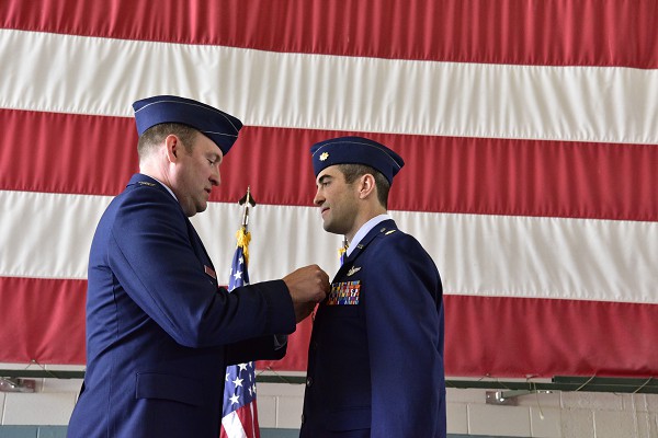 Kirkland Air Force Base, New Mexico. (September 21, 2022): In this photo by Jessie Perkins, U.S. Air Force Colonel Bradley Downs (left) pins the Distinguished Flying Cross with Valor on Major Michael Tolzien of the Air Force 58th Special Operations Wing. The Distinguished Flying Cross with Valor is awarded for heroism at grave personal risk far beyond the call of duty in direct combat and exposed to enemy hostilities. An aircraft commander, Major Tolzien risked his life to provide air drop support to allied forces under fire.