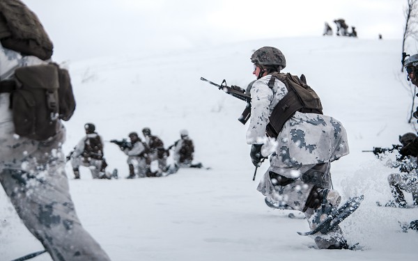 Blatind, Norway. (October 15, 2022): In this photo by Corporal Patrick King, U.S. Marines with Marine Rotational Force Europe buddy rush down range during a company live fire attack as part of Exercise Arctic Littoral Strike. These exercises focus on regional engagements in arctic and mountain warfare as America prepares to defend Europe against Russian aggression.