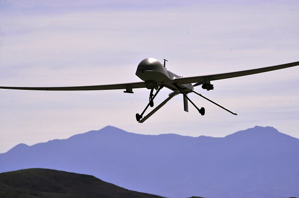 Creech Air Force Base, Indian Springs, NV. (October 18, 2022). In this photo by Senior Master Sergeant Paul Holcomb, an MQ-1B Predator remotely piloted aircraft passes over the airfield during a recent training mission. Part of the 432nd Air Expeditionary Wing, Predators conduct surveillance, reconnaissance, and close air support for America’s warfighters around the world. 