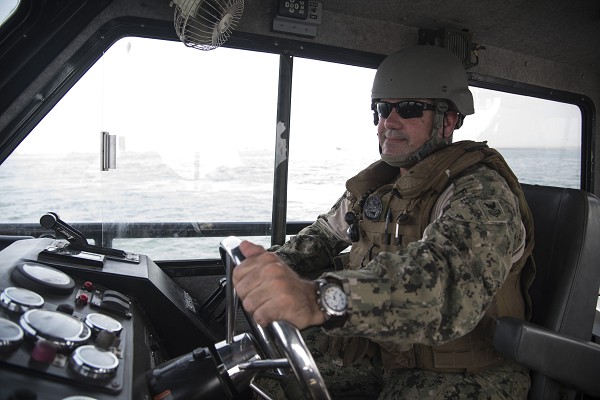 Djibouti. (November 12, 2022): U.S. Navy Petty Officer 1st Class James Padden, a Coastal Riverine Squadron Captain assigned to Combined Joint Task Force Horn of Africa, drives a Sea Ark Dauntless patrol boat, a craft now being shipped to Ukraine to help fight the Russians on the Dnipro River.