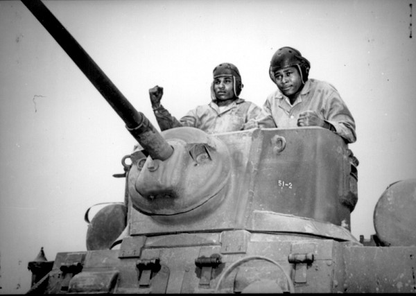 Fort Hood, TX. (November 19, 2022): In this photo from the National Archives, two African American soldiers with the 761st Tank Battalion, better known as the Black Panthers, train for combat in Europe aboard the M5 Stuart light tank. The Black Panthers would endure a record 183 days in combat and would liberate 30 towns on their campaign through Germany in World War II.