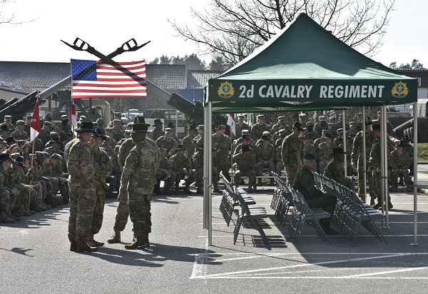 Vilseck, Germany. (November 15, 2022): In this photo by Sergeant William A. Tanner, Troopers assigned to 2nd Squadron, 2nd Armored Cavalry Regiment, talk with each other before the start of the squadron's Battle of 73 Easting commemoration ceremony held at Rose Barracks, Germany. The event celebrates the unit's historic Operation Desert Storm victory over the elite Iraqi Republican Guard in the Battle of 73 Easting in the Gulf War.