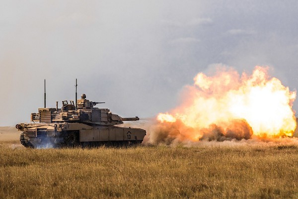 Smardan, Romania. (November 16, 2022): In this photo by Sergeant Dommnique Washington, an American M1 Abrams main battle tank participates in live fire exercises with NATO ally Romania outside the town of Smardan. Since the illegal invasion of Ukraine, allied armored forces have poured into Romania, Poland, and Bulgaria along with thousands of servicemembers who will spending this holiday away from home.