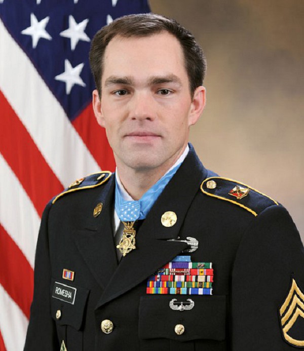 Arlington, VA. (November 14, 2022): In this photo by Monica King, U.S. Army Staff Sergeant Clinton L. Romesha poses for an official portrait as a Medal of Honor recipient at the Army Portrait Studio at the Pentagon, Arlington, Virginia. SSgt. Romesha was awarded the Medal of Honor for actions while serving as a section leader with Bravo Troop, 3rd Squadron, 61st Cavalry Regiment, 4th Brigade Combat Team, 4th Infantry Division, during combat operations against an armed enemy at Combat Post Keating, Kamdesh District, Nuristan Province, Afghanistan.