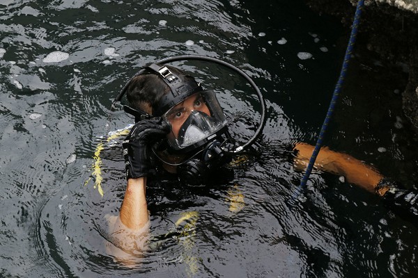 CAMP ARIFJAN, Kuwait (November 18, 2022): Specialist Cesar Rodriquez, a diver with the 7th Engineer Diver Detachment, receives instructions from a diving supervisor before leaving the surface during an annual salvage diver training exercise at Kuwait Naval Base.  