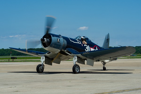Virginia Beach, VA. (November 30, 2022):  In this photo by MC3 Megan Wollam, an FG-1D Corsair, flown by Mike Spalding, Chief Pilot at the Military Aviation Museum, taxis after a heritage flight with Strike Fighter Squadron 103 onboard Naval Air Station Oceana. The Corsair was once assigned to the famous “Jolly Rogers” Fighter Squadron VF-17 in 1943 and shares the same call sign. These flying buccaneers downed 154 Japanese airplanes in just 76 days of combat earning them the grudging respect of their enemy who called them “Whispering Death”.